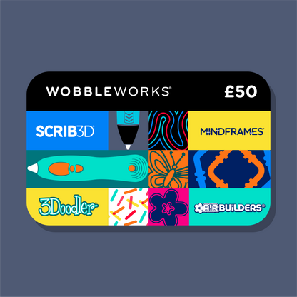 A Wobbleworks gift card featuring a colorful grid of icons including Scrib3D, Mindframes, 3Dooler, and AirBuilders on a dark slate blue background.